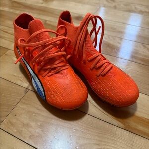 Puma Kids Orange Soccer Sneakers with Blue Accent